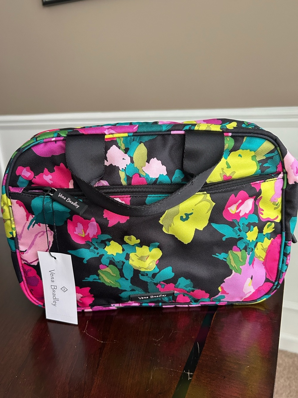 Vera Bradley Black Floral Travel Bag with Pink, Yellow & Teal Floral Accents.